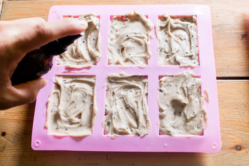 Spritzing coffee soap in the mold.