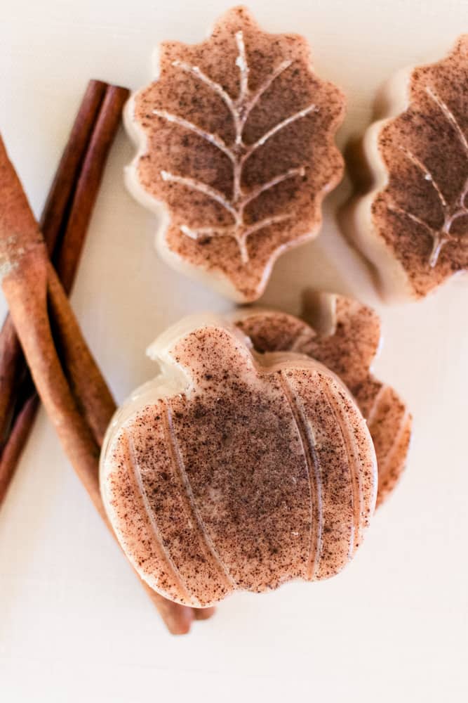 A pumpkin spice soap close up with cinnamon stick. 