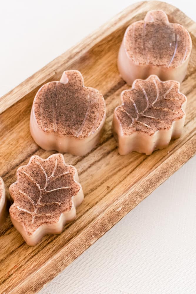 Pumpkin spice soap bars on a wooden board. 