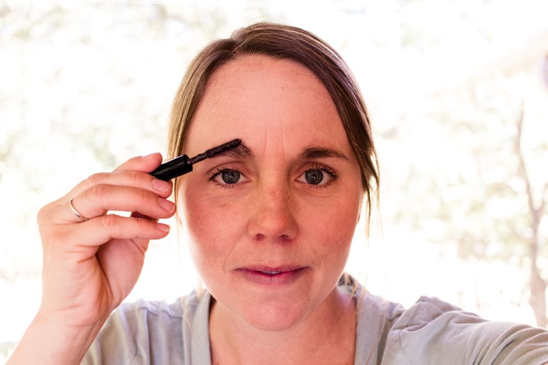 Laura applying her DIY eyebrow gel. 