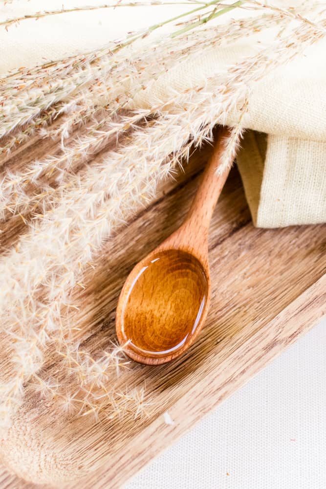 Wheat germ oil on a wooden spoon. 