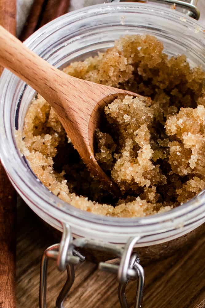 Fall body scrub in a glass jar with wooden spoon. 