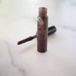 Diy eyebrow gel in a small glass container.