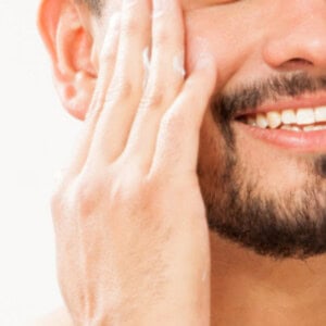 Massaging in aloe to the sides of the face to prevent razor burn.