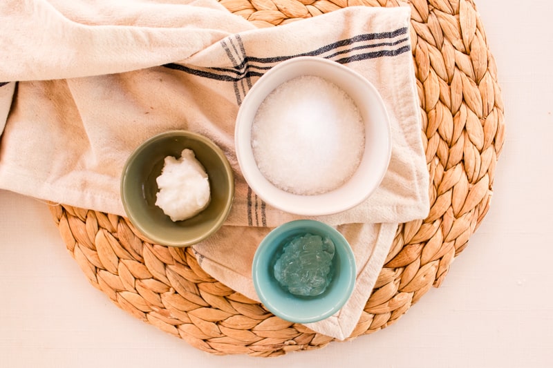 3 different ingredients, aloe vera, coconut oil and epsom salts in separate containers to be used as razor burn relief.