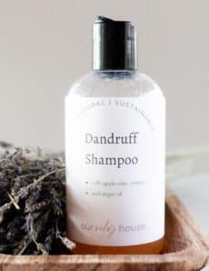 Homemade dandruff shampoo in a repurposed pop top bottle.