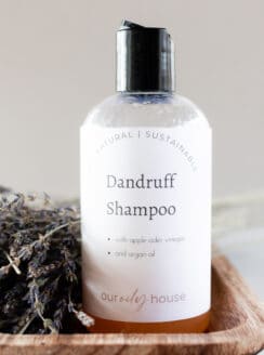 Homemade dandruff shampoo in a repurposed pop top bottle.