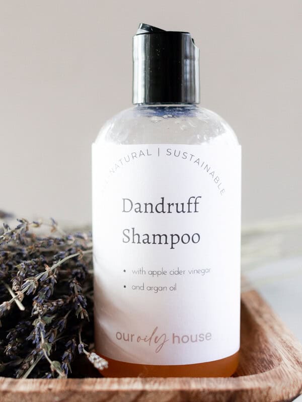 Homemade dandruff shampoo in a repurposed pop top bottle.