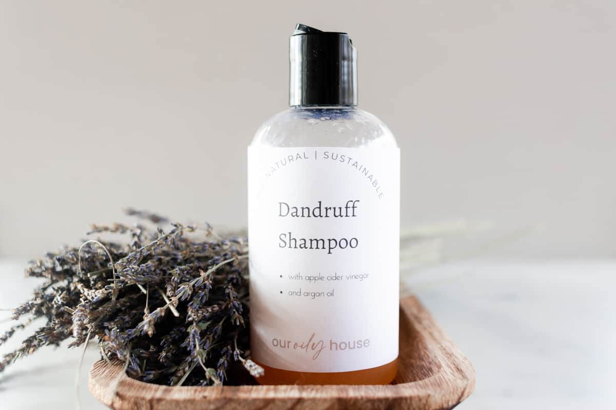 Homemade dandruff shampoo in a repurposed pop top bottle.