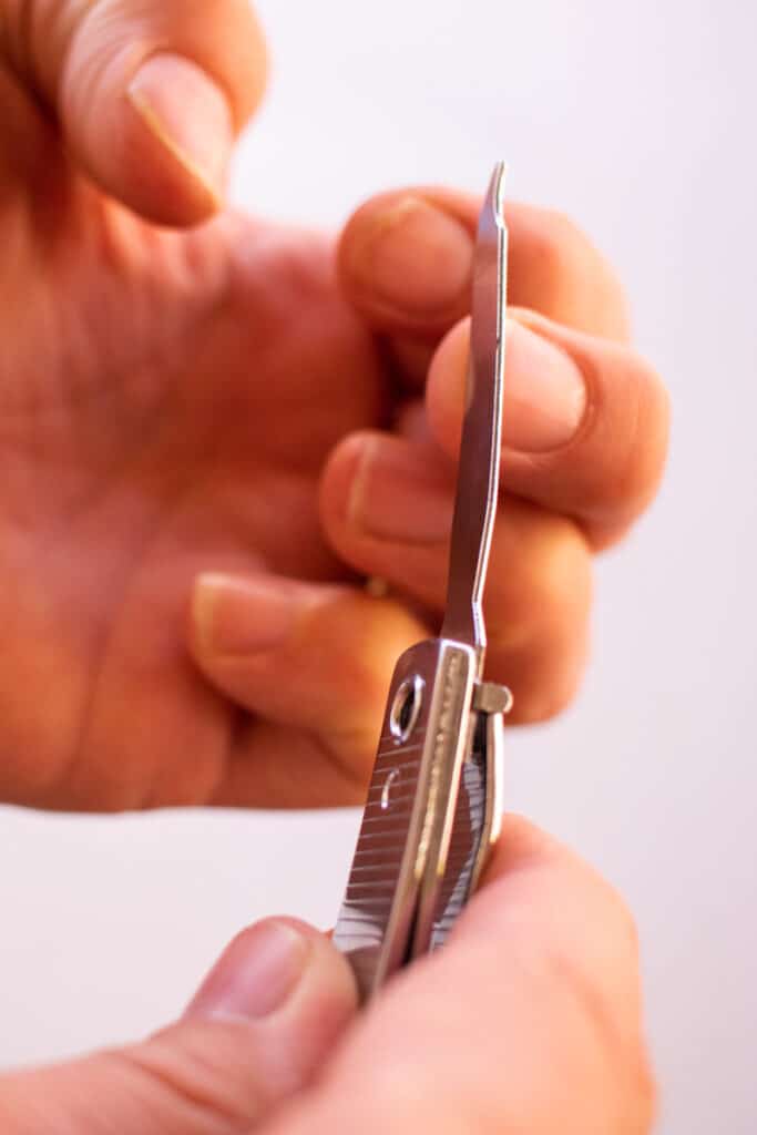Filing nails as part of natural nail care.