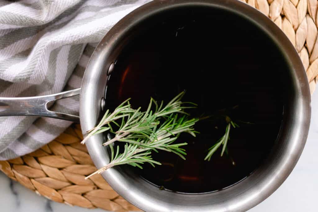 Rosemary sprigs in water. 