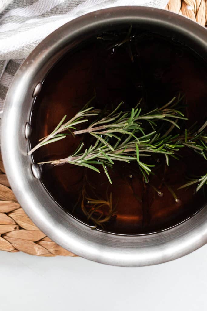 Rosemary sprigs in water. 
