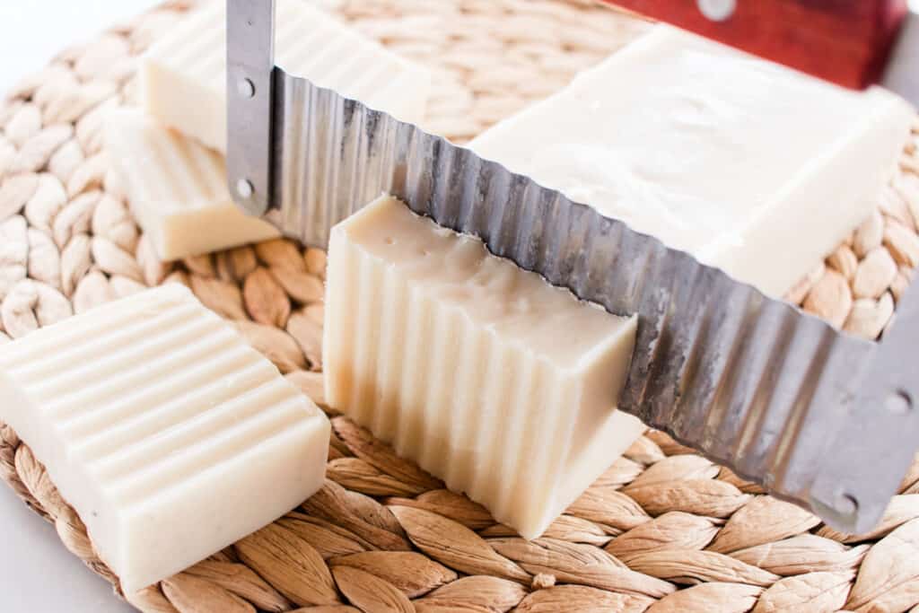 Cutting beeswax soap bars. 