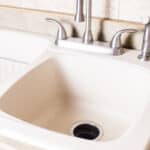 A clean white granite composite sink.