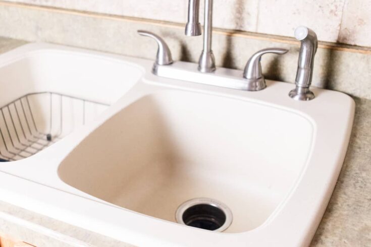 A clean white granite composite sink.