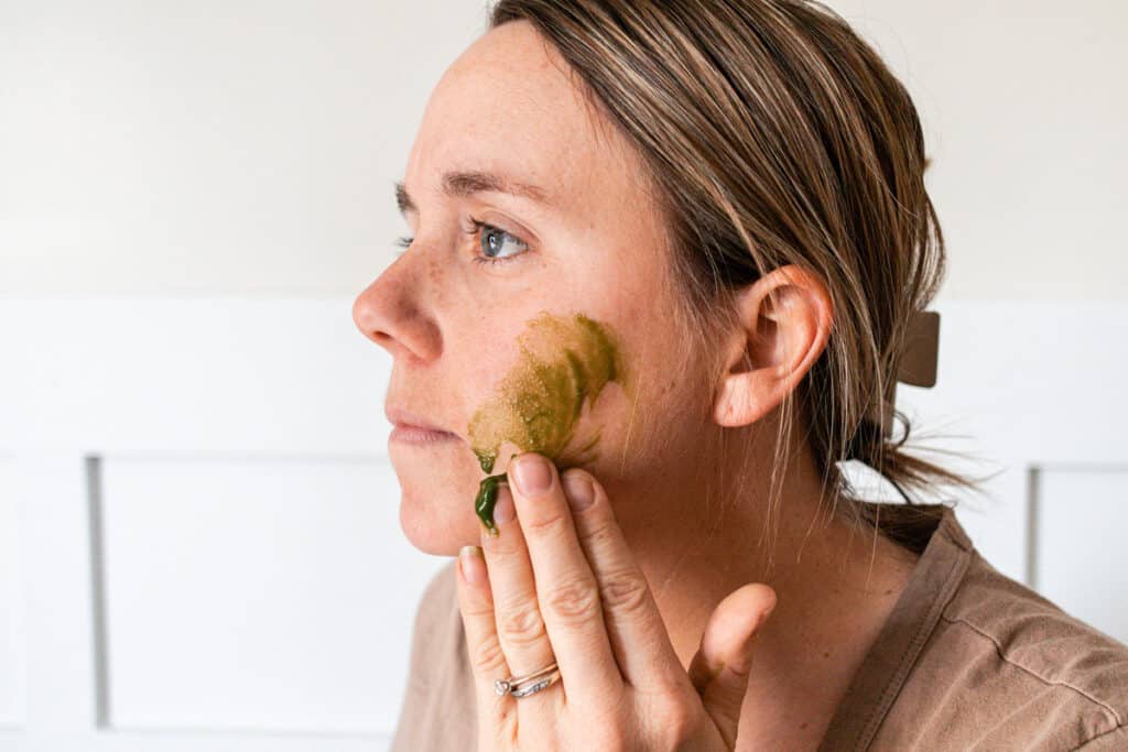 Applying gel face cleanser to the skin. 