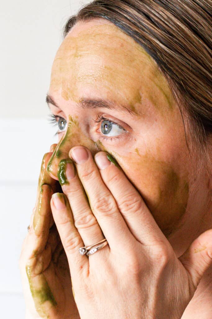 Applying face cleanser gel.