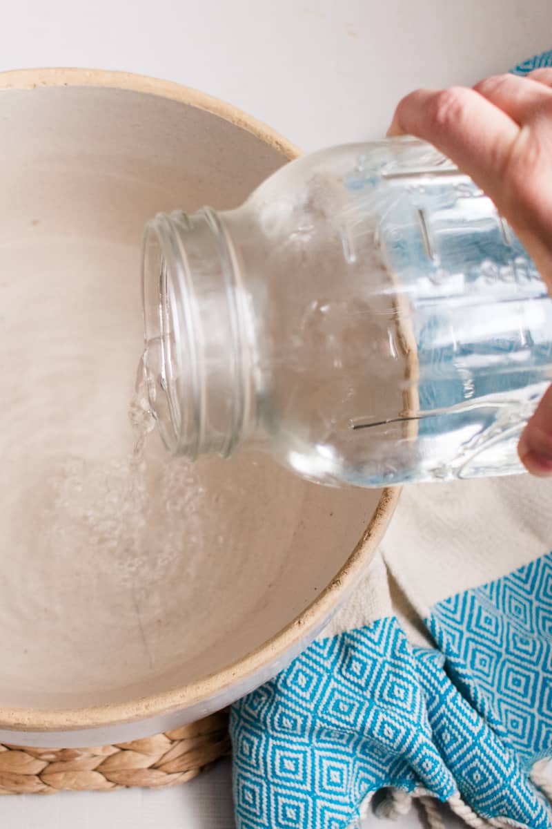 Making baking soda vinegar foot soak. 