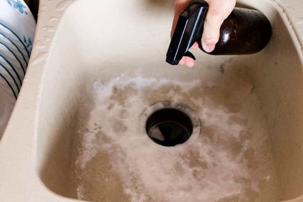 Adding baking soda to clean a composite sink