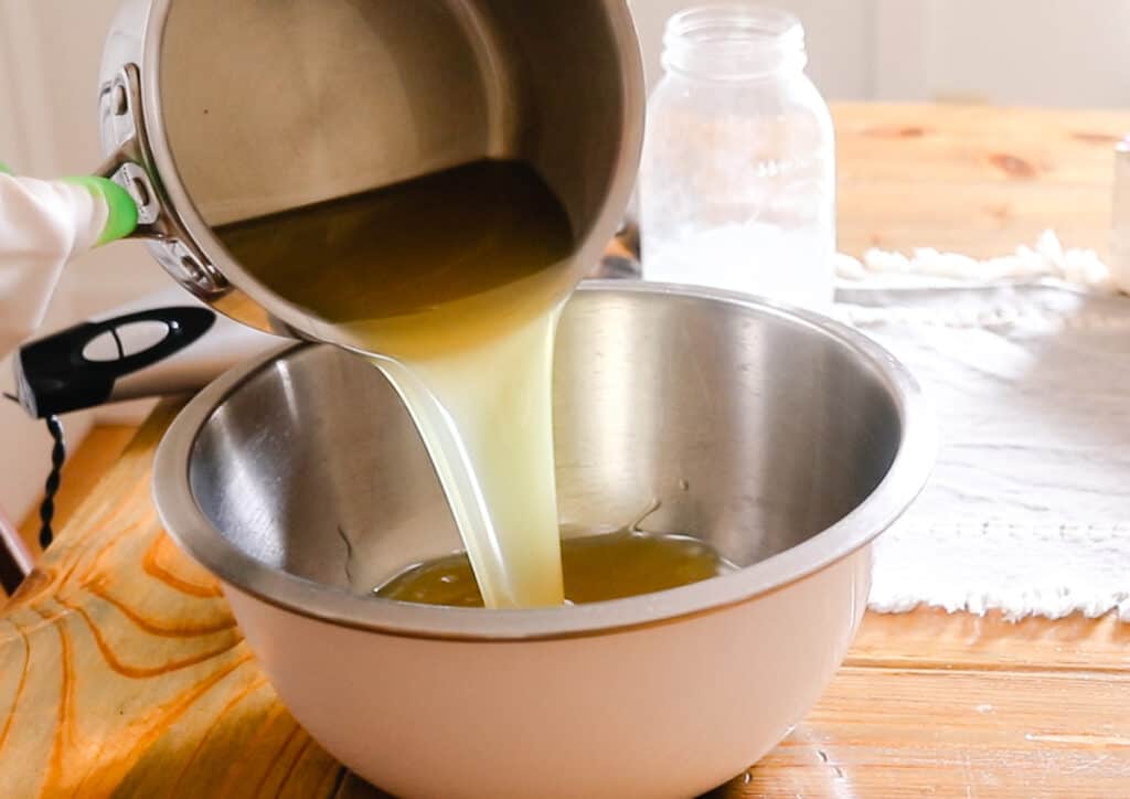 Pouring the melted fats in to a mixing bowl.