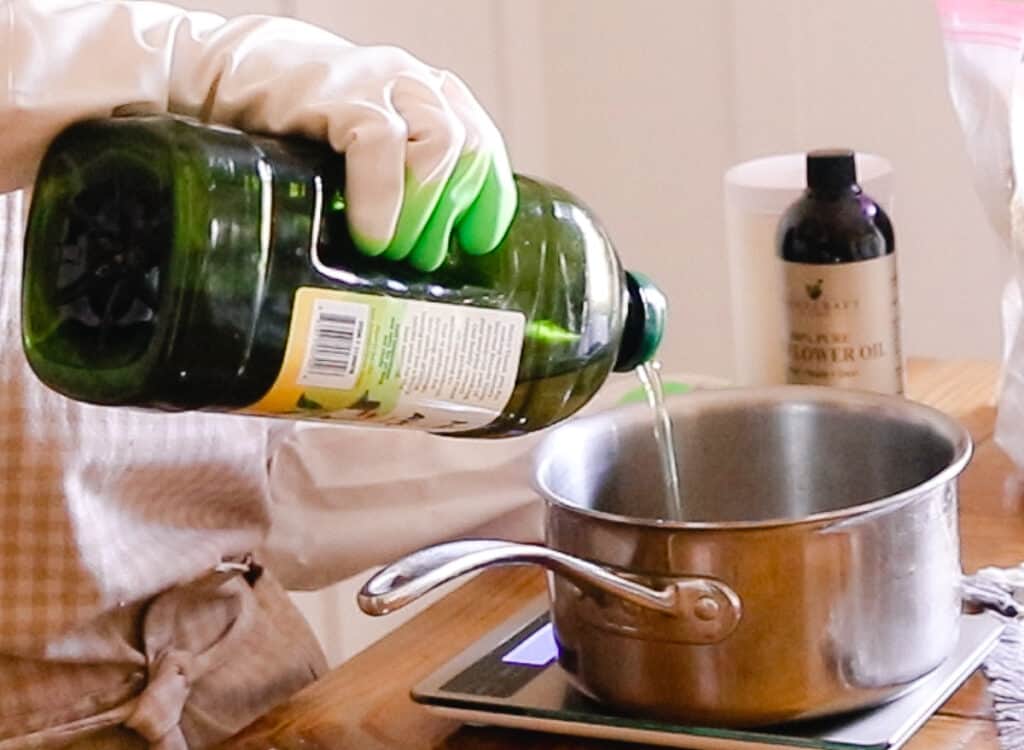 Melting the oils and fats in a saucepan for the soap bar.