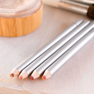 4 lip liner pencils hand made on the edge of a vanity.