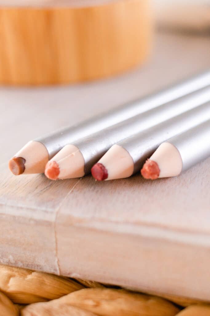 Homemade lip liner pencils on the edge of the vanity.