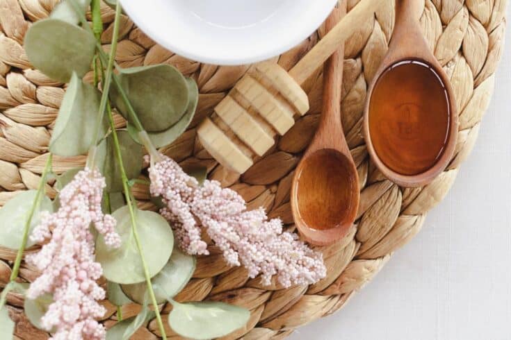 A homemade under eye mask with measuring spoons and dried flowers.