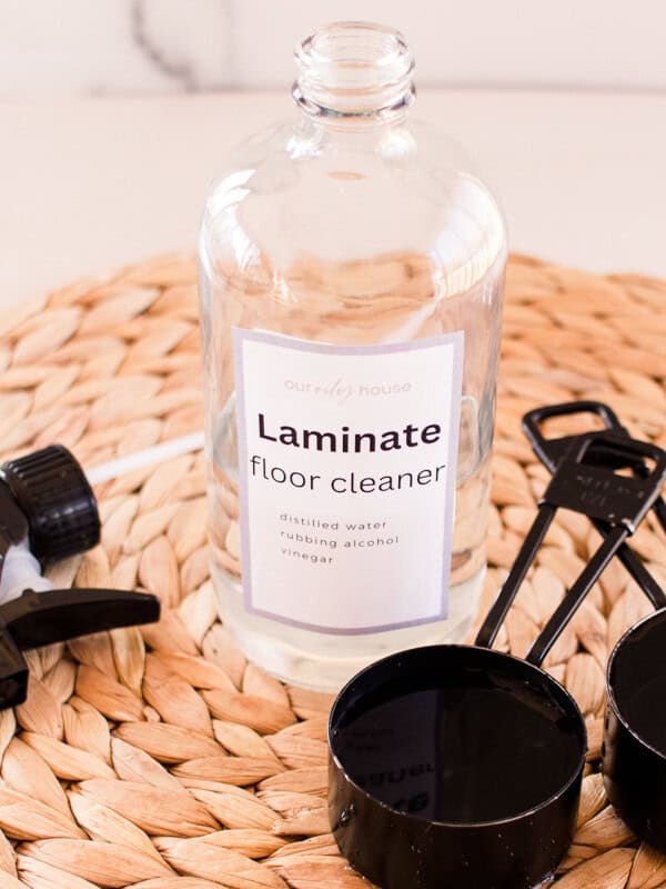 Laminate floor shiner with measuring tools and a sprayer nozzle.