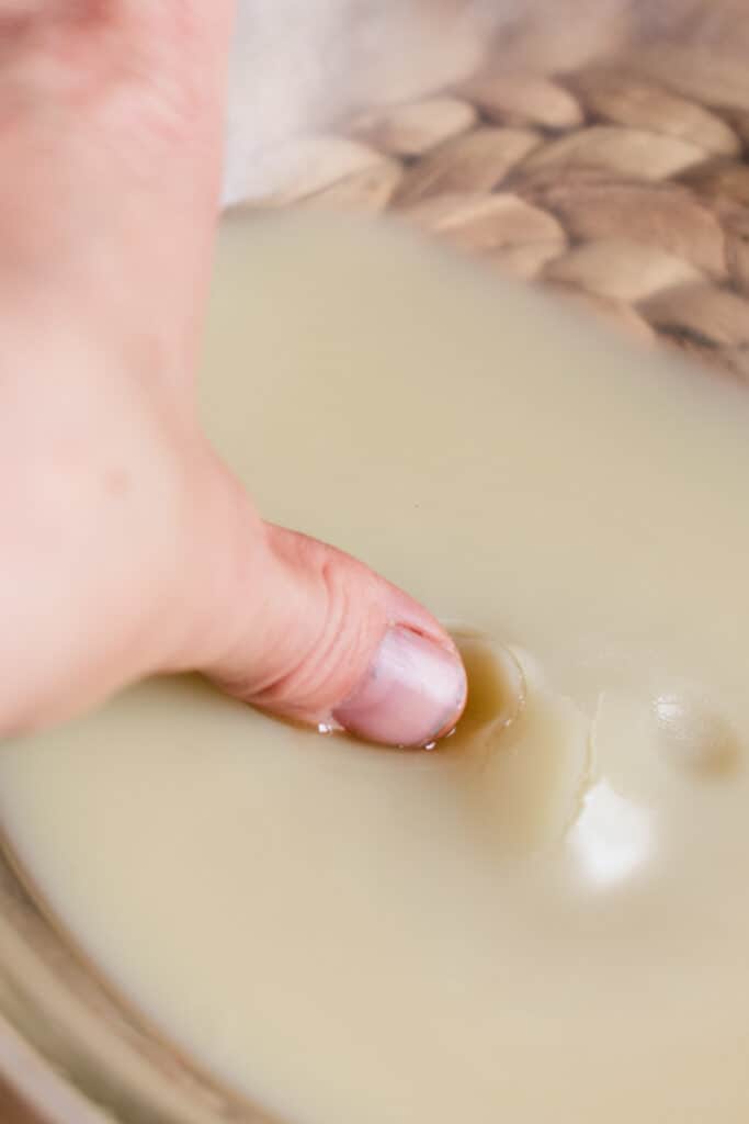 Checking the hardness of the tinted moisturizer.