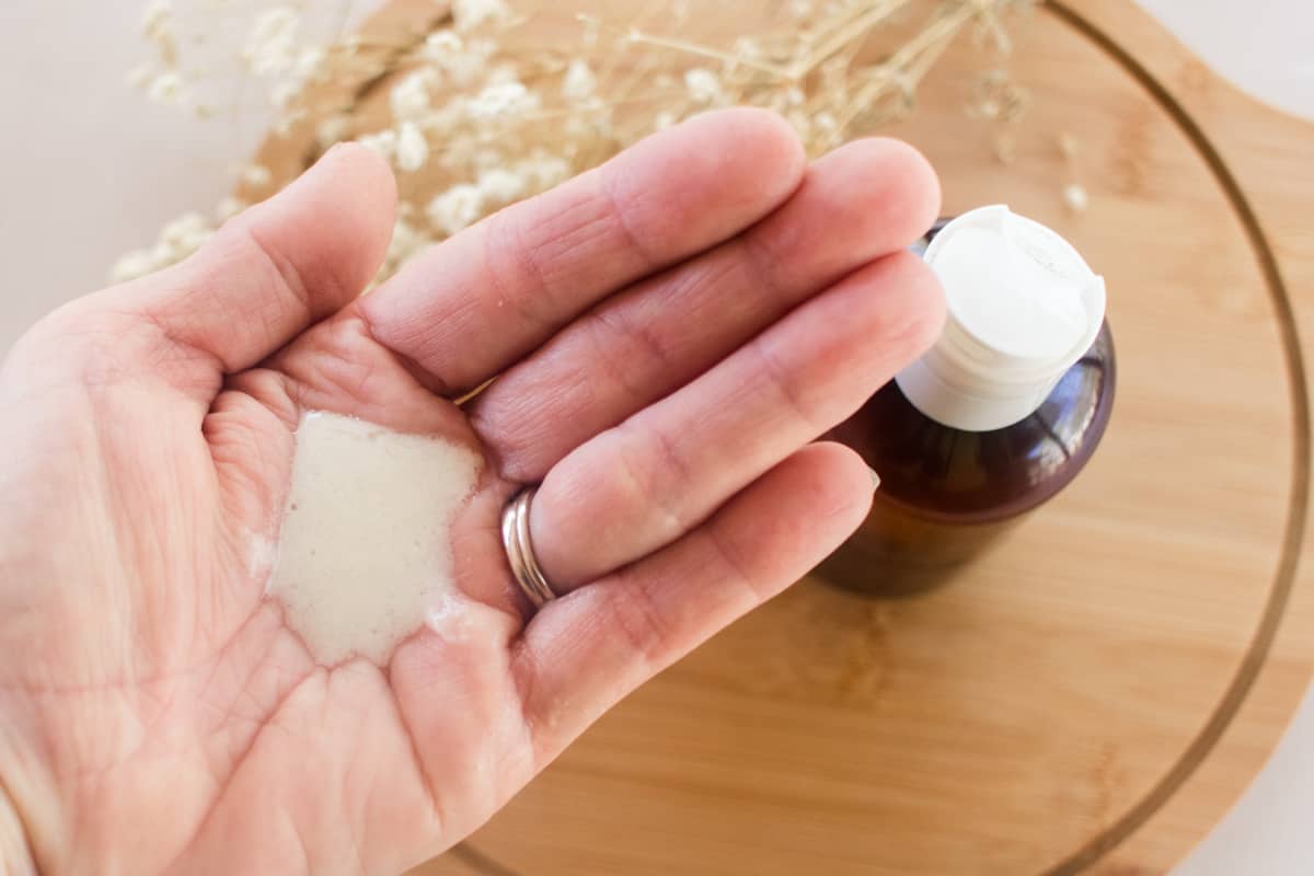 A DIY hair conditioner in the palm of a hand.