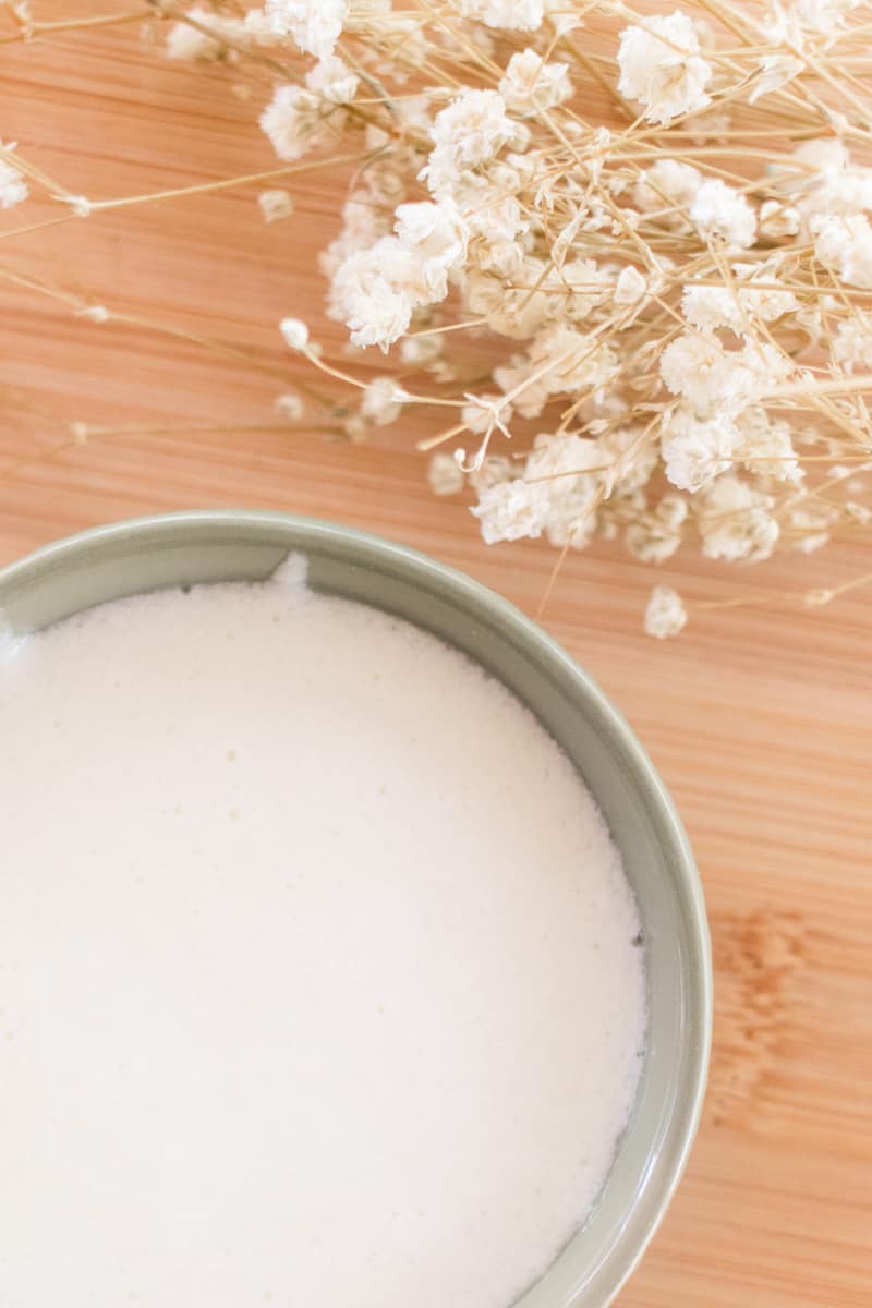 Homemade conditioner in a green bowl.