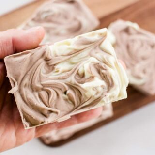 Holding a stylish soap bar for men.