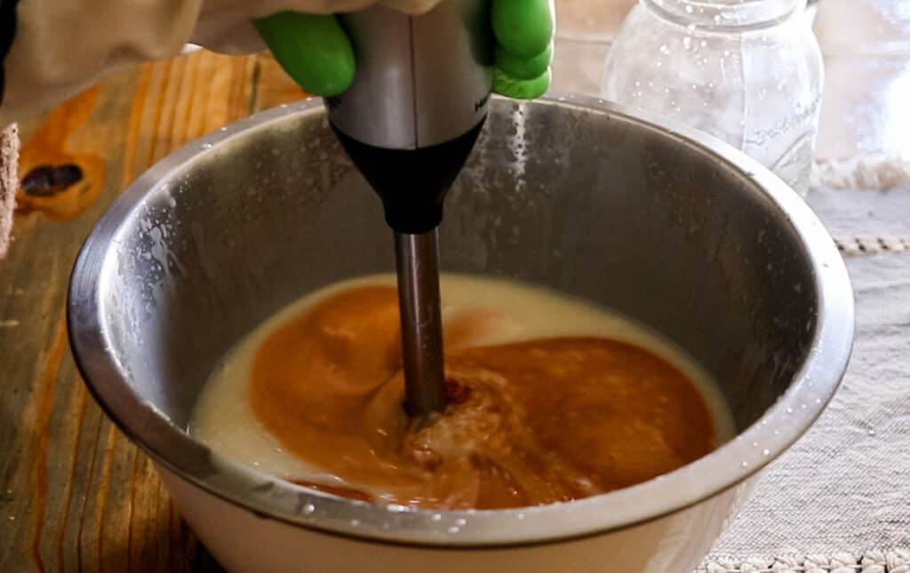 Stirring in turmeric powder.