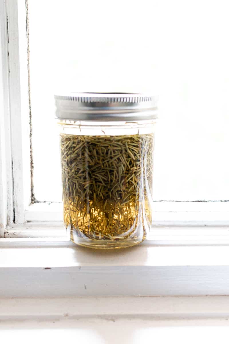 Infusing rosemary oil in the sun in a windowsill.