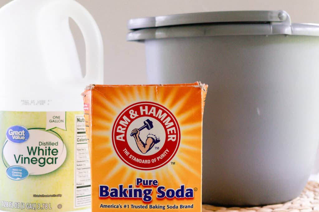Baking soda vinegar and a large pail for soaking workout clothes.