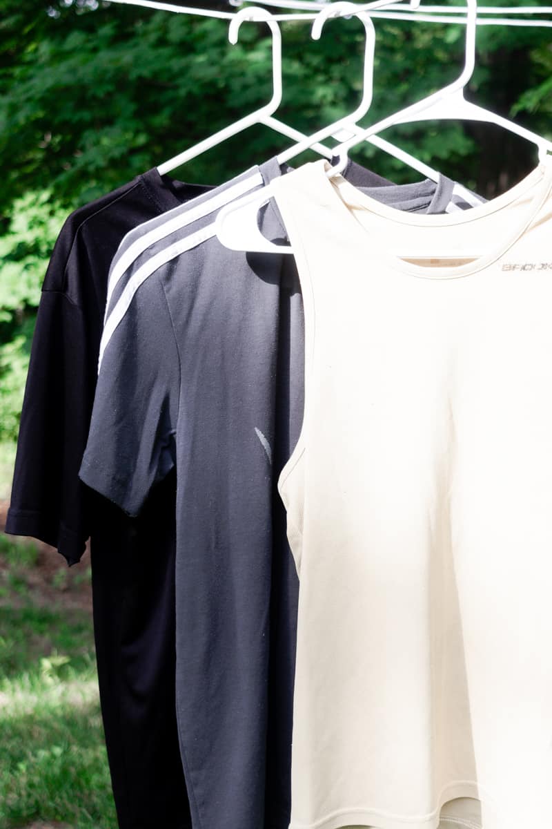 Hanging workout gear to dry on a hanger. 