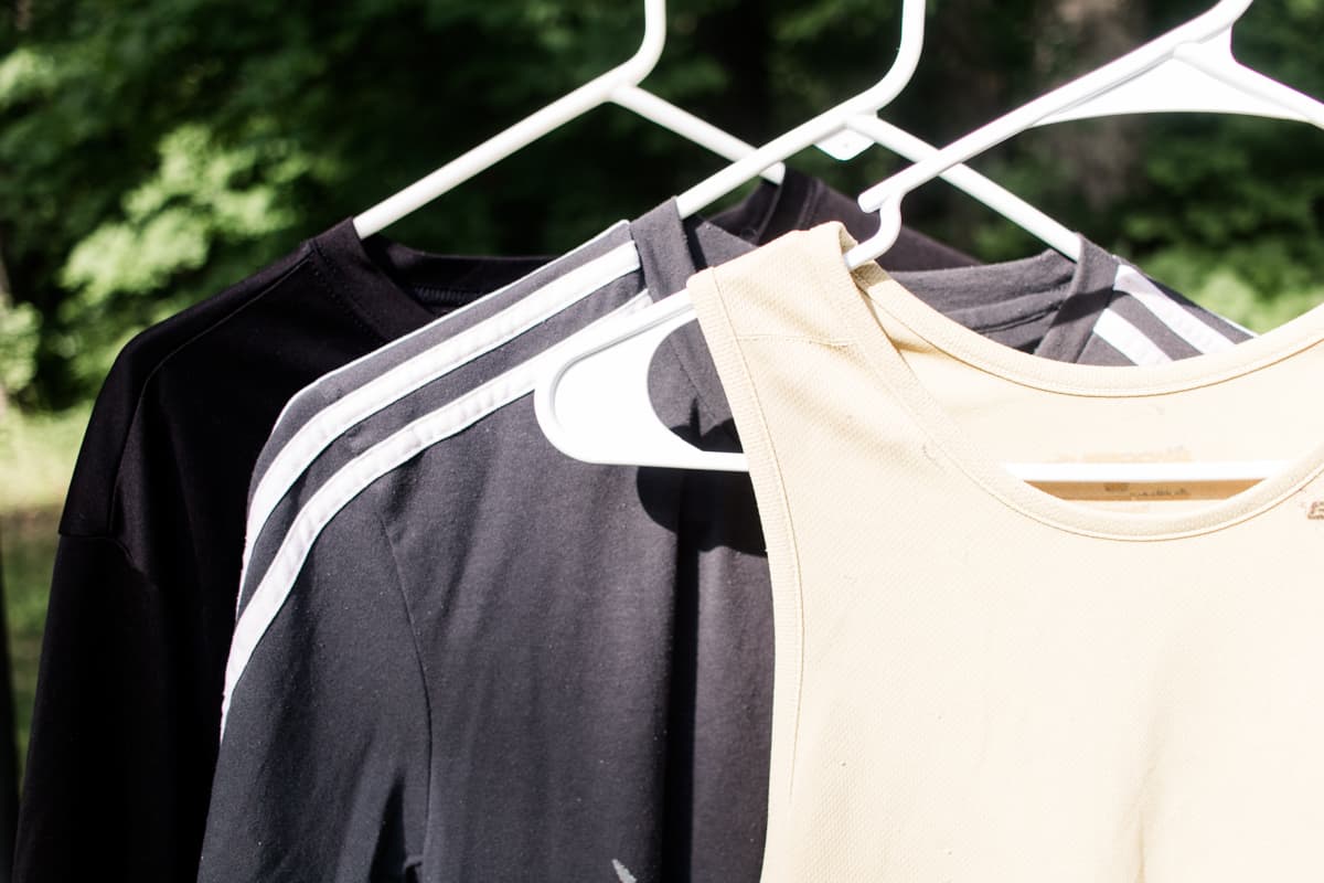 Hanging workout clothes outdoors to dry. 