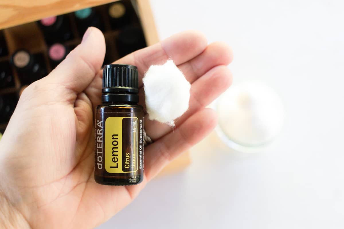 A jar of lemon essential oil and a cotton ball to place in the corner of a closet.