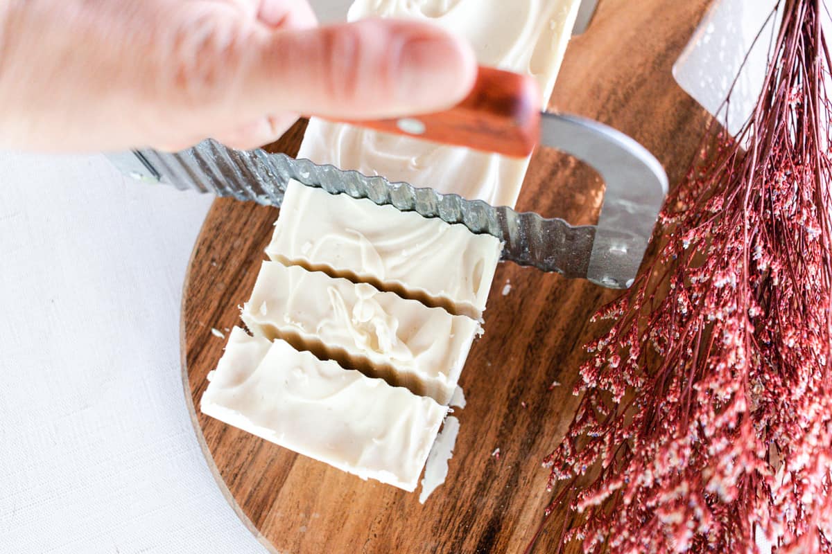Cutting the hardened soap into bars.