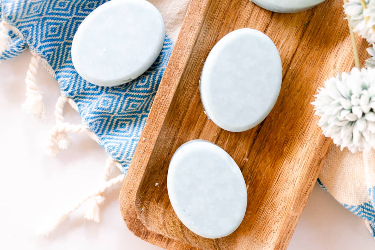 Sea salt soap bars on a wooden board. 