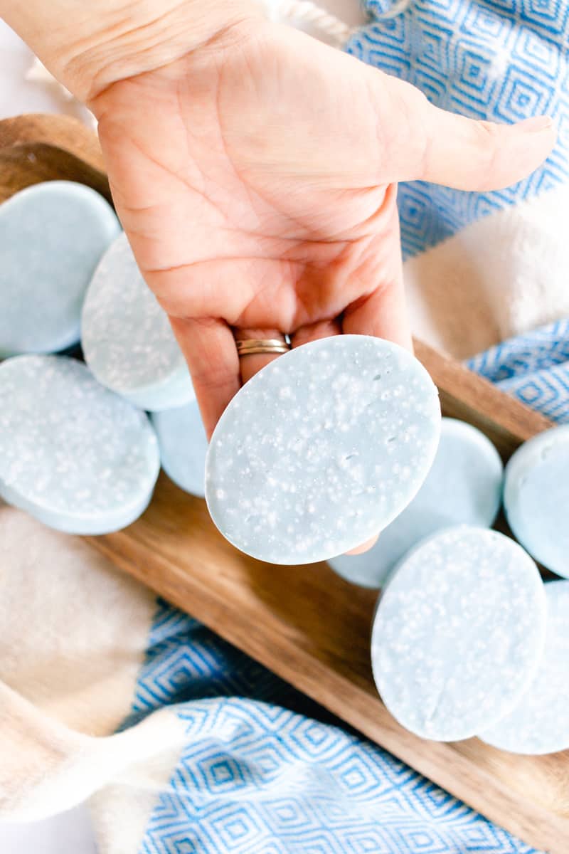 Holding a exfoliating soap bar after it has been removed from the mold.