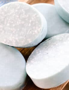 Oval Sea salt soap bars curing on a wooden drying rack.