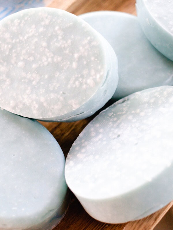 Oval Sea salt soap bars curing on a wooden drying rack.
