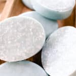 Sea salt soap bars drying on a wooden drying rack.