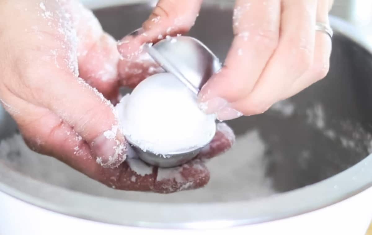 Removing the hard toilet bomb from the mold.