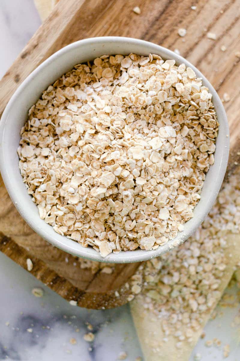 Oats in a bowl to make into colloidal oatmeal for the skin.