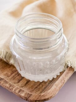 A small jar of coconut oil to use for tanning.