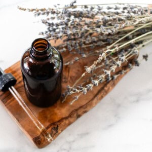 A homemade tanning oil on a marble counter.