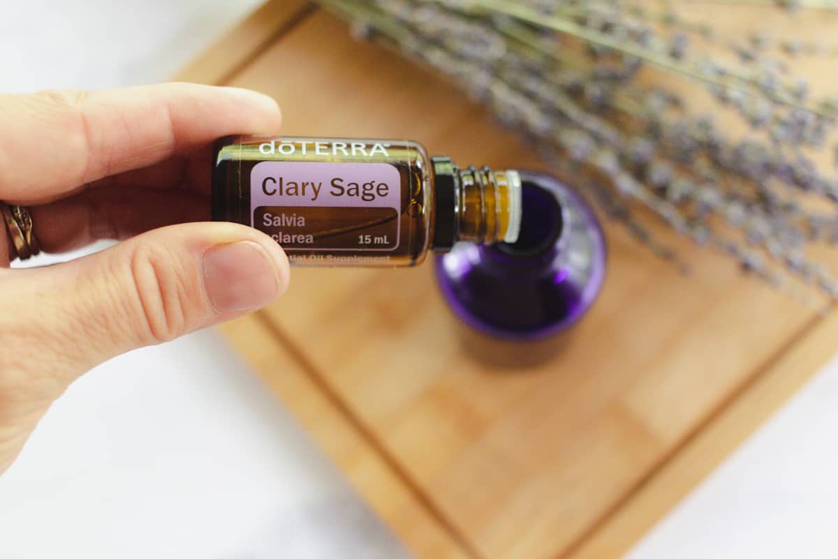 Adding essential oils to the homemade hair moisturizer oil.